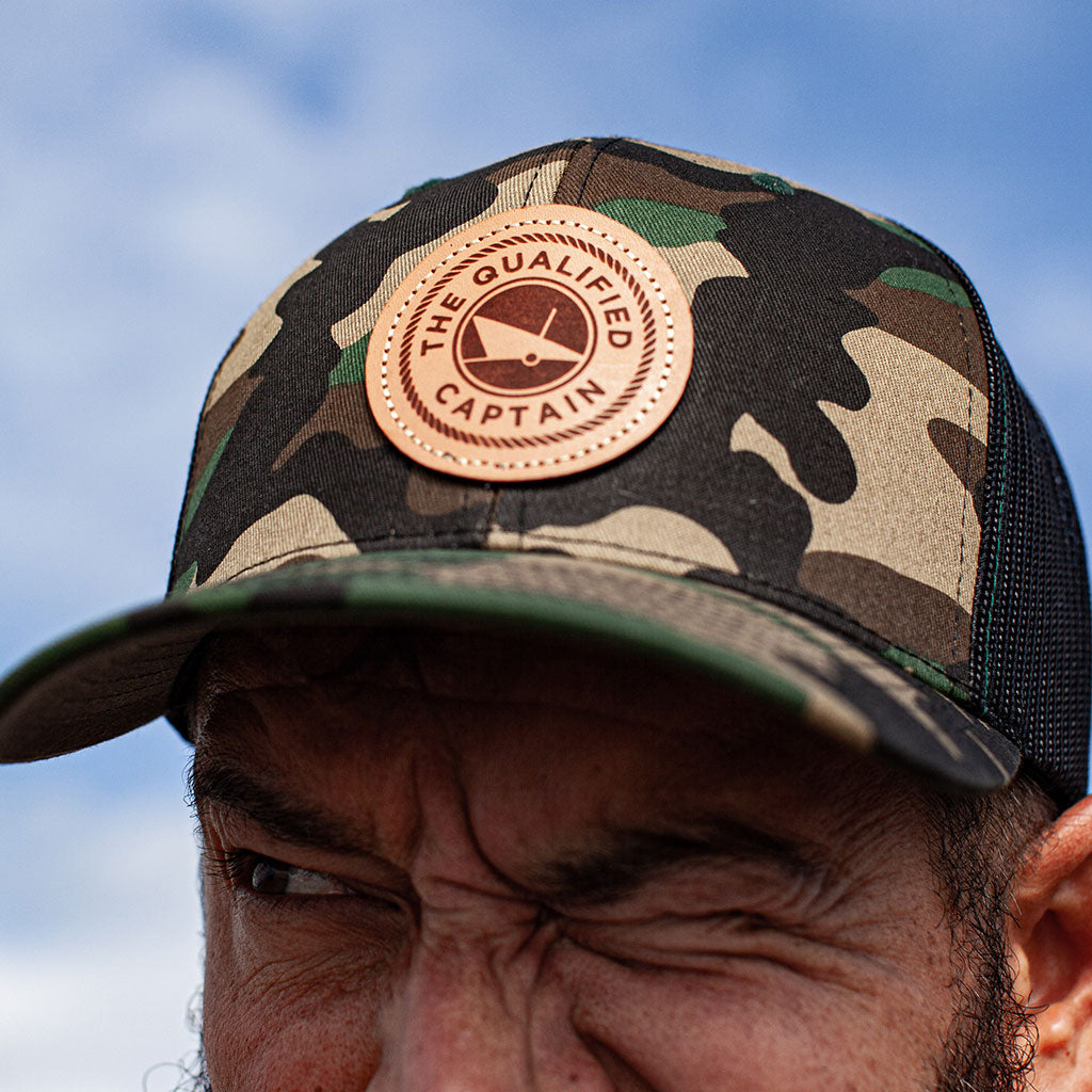 qualified captain trucker hat with leather patch richardson camo trucker hat